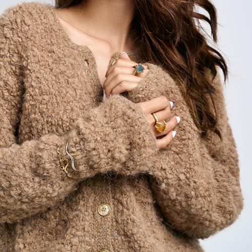 Model wearing Rawan Kanan 'The Solar' statement ring with a raw yellow citrine crystal in a 1-micron 14K gold-plated sculptural setting.