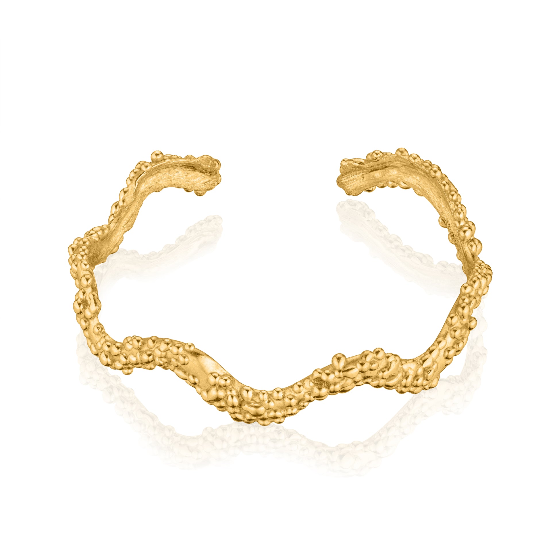 Dainty sculptural wave cuff with organic granulated texture in 14K gold plated silver."