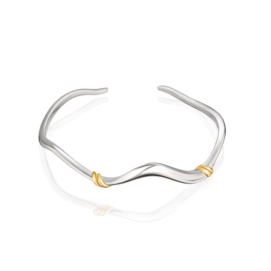 Dainty minimalist wave cuff bracelet in 925 sterling silver with 14k gold accents by Rawan Kanan jewelry.